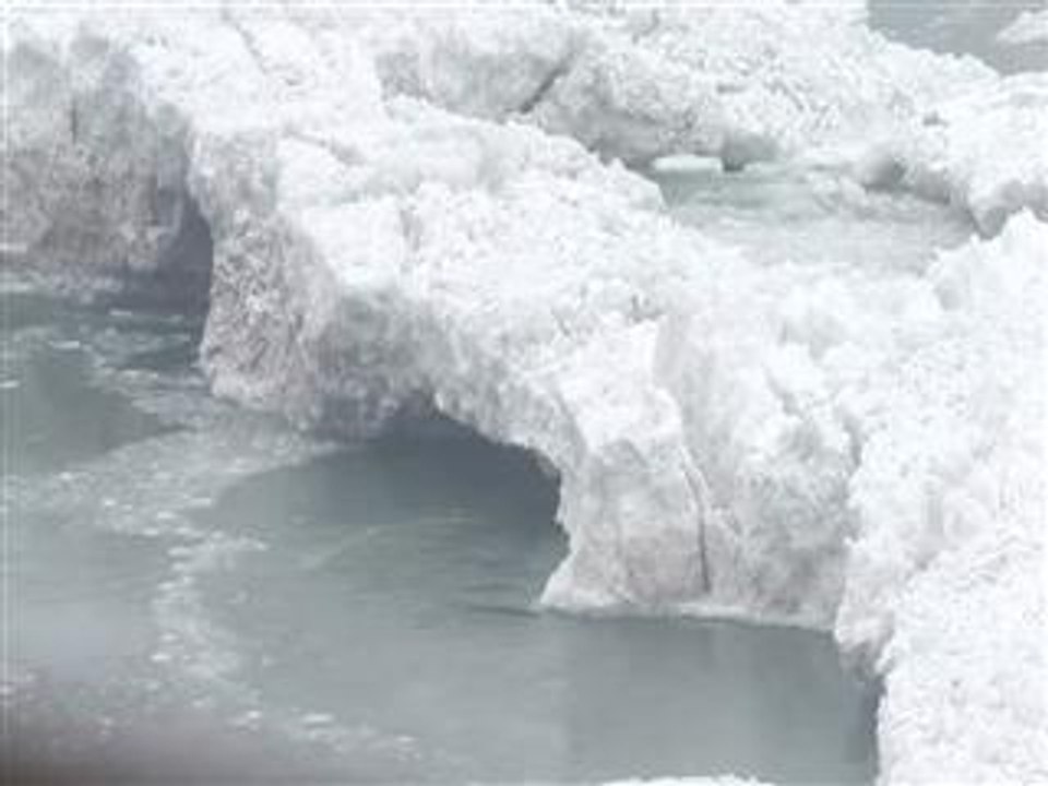 Water still cascades over nearly frozen Niagara Falls