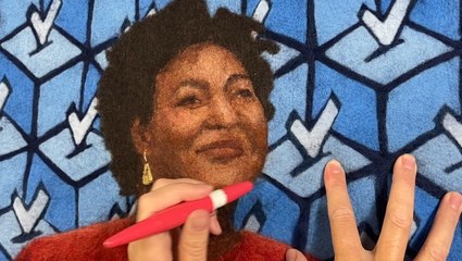 Artist paints portraits with wool