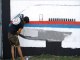 Malaysia graffiti artists paint mural of missing jet