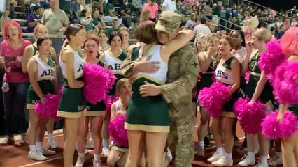 Military Dad Surprises Cheerleader Daughter By Photobombing Group Photo | Happily TV