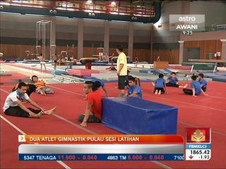 Dua atlet gimnastik pulau sesi latihan