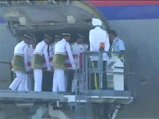 The casket is offloaded