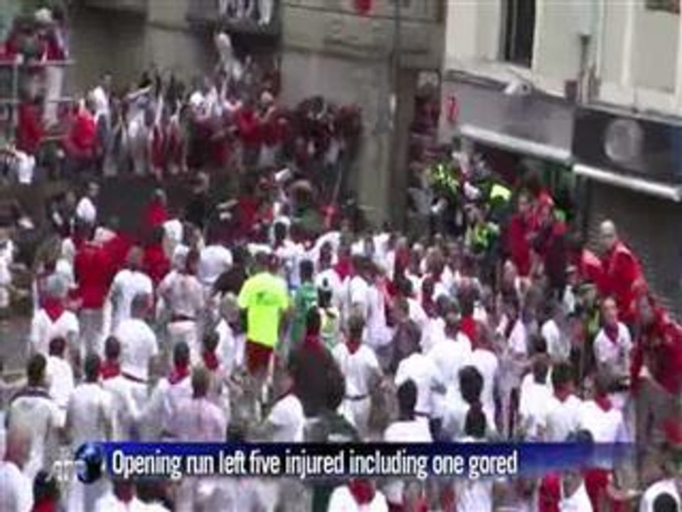 Men vs bulls on slippery cobbled streets of Pamplona