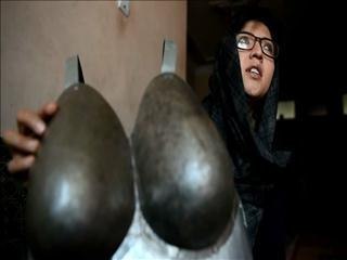 Afghan artist in hiding after sexual harassment protest