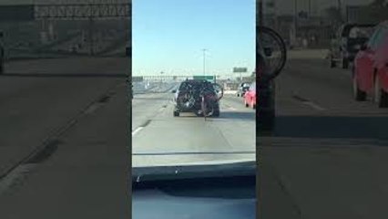 Bicycle Rides Behind Car on Highway