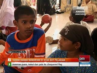 Kanak-kanak sendirian di atas bot pelarian