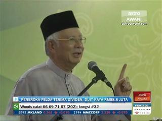 Peneroka Felda terima dividen, duit raya RM88.8 juta