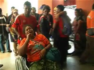 Melancholy fills the air as family members fight back tears