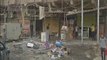 Iraqis clean up after deadly bomb attacks