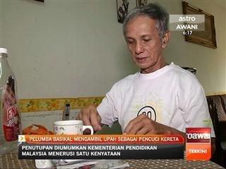 Pelumba basikal mengambil upah sebagai pencuci kereta