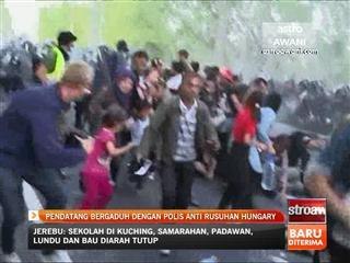Pendatang bergaduh dengan polis anti rusuhan Hungary