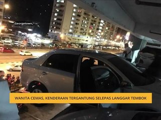 Wanita cemas, kenderaan tergantung selepas langgar tembok