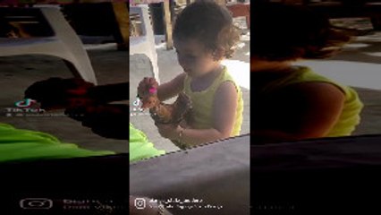 Girl Shows Bird Reflection in Tiny Mirror