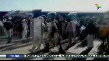 Migrants clash with police in Mexico border town