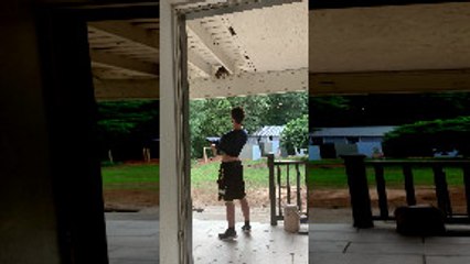 Guy Uses His Shirt to Help a Stuck Kitten