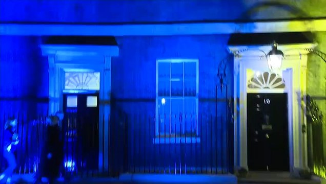 Liz Truss arrives at blue and yellow 10 Downing Street