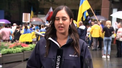 Hundreds of protestors rally for peace at Sydney's Martin Place