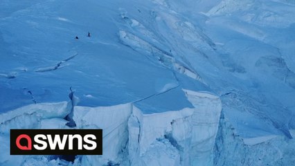 Incredible footage shows thrill-seeker friends ski-base jumping on dangerous glacier