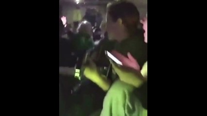 Ukraine people in shelter playing a guitar and singing for life. War in 2022