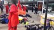 Climate activists stage die-in protest outside Barclays over fossil fuel investments