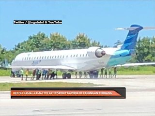 Kecoh ramai-ramai tolak pesawat Garuda di lapangan terbang