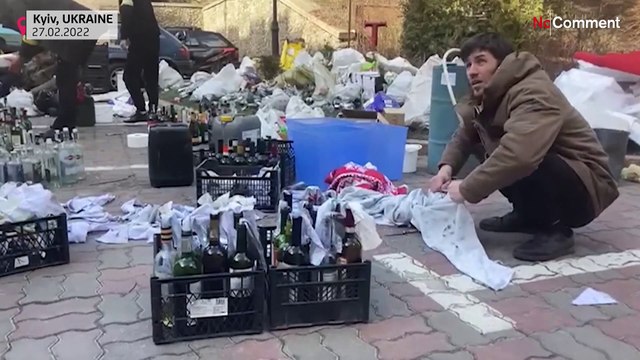 Ukrainians in Kyiv prepare Molotov cocktails