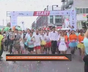 Pasangan baru kahwin abadikan kenangan dalam acara larian