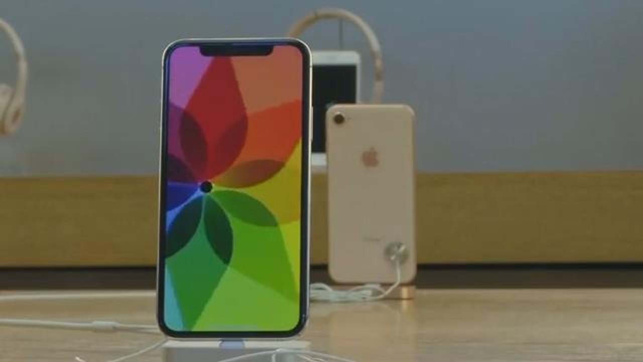 Apple stock hits record