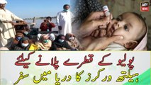 Health workers travels in the river to give Polio Drops