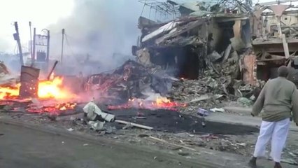 Dual car bombs kill at least 22 in Somalia's capital