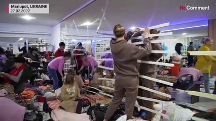 Ukrainians find shelter in gym, hope for peace