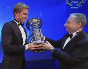 Rosberg celebrates with F1 trophy after announcing his retirement