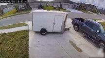Trailer on The Loose Crashes Into Parked Truck in Driveway