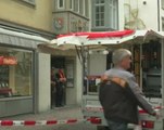 Residents worried for victims of Swiss chainsaw attack, suspect still on run