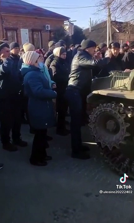 Ukrainian civilians holding up a Russian convoy!