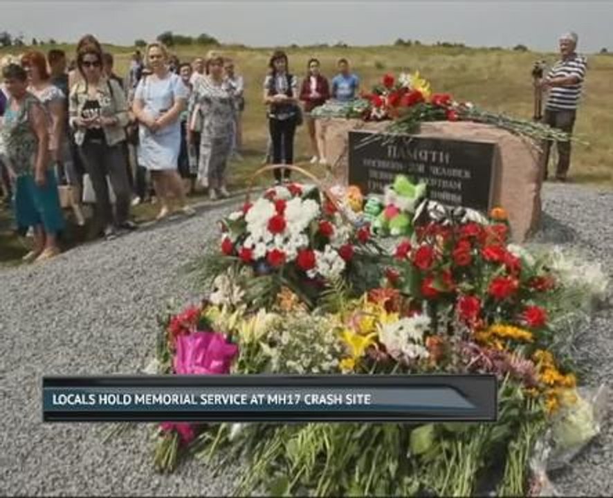 Locals hold memorial service at MH17 crash site