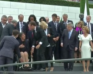 French President Macron makes sure disabled committee president gets front place in group photograph