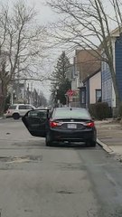 Car Drives With Back Door Wide Open