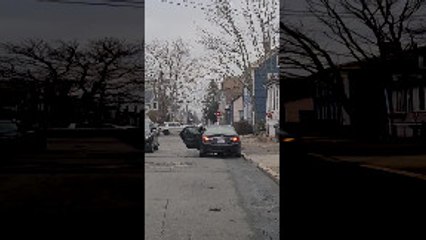 Car Drives With Back Door Wide Open