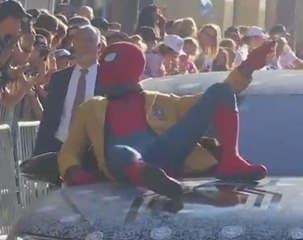 Tom Holland arrives in style for 'Spider-Man' premiere