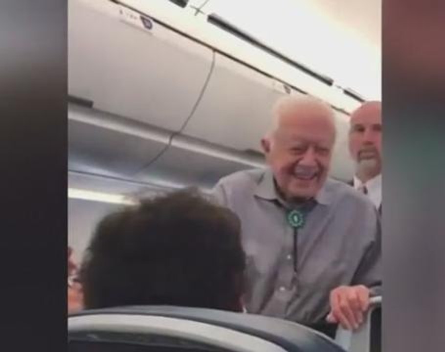 Former President Carter greets passengers on DC-bound flight