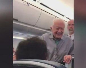 Former President Carter greets passengers on DC-bound flight