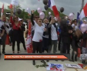 Isteri pegawai polis berarak peringati mangsa tembak