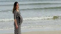 Husband takes photo of pregnant wife at the perfect moment