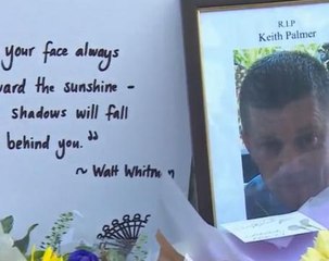 London police officers lay flowers in tribute to PC Palmer