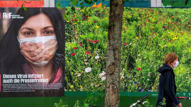 God Will Save Me: Woman Chooses to Wear a Bible as a Mask to Protect Her From COVID-19