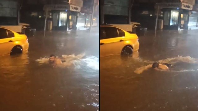 Antalya'da yollar göle döndü, bir vatandaş araçlar arasında yüzdü
