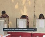 Candidates cast votes to elect Jakarta governor