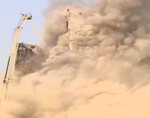 Burning Tehran tower block collapses