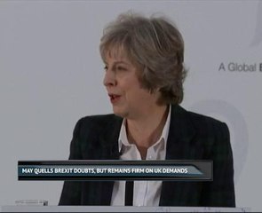 May quells Brexit doubts, but remains firm on UK demands